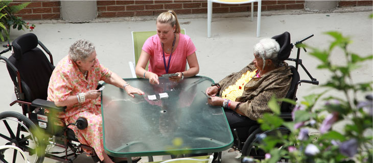 three women play cards
